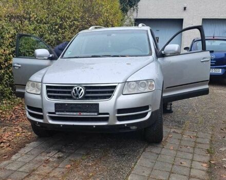 Сірий Фольксваген Туарег, об'ємом двигуна 3 л та пробігом 302 тис. км за 6402 $, фото 1 на Automoto.ua