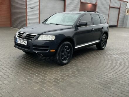 Серый Фольксваген Туарег, объемом двигателя 3.6 л и пробегом 295 тыс. км за 5500 $, фото 1 на Automoto.ua