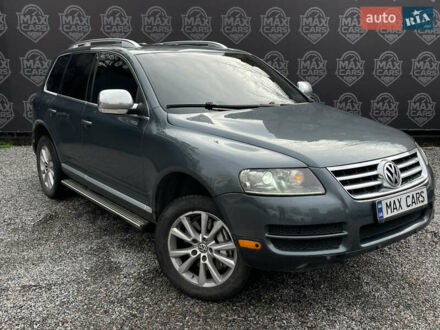 Сірий Фольксваген Туарег, об'ємом двигуна 5 л та пробігом 235 тис. км за 7300 $, фото 1 на Automoto.ua