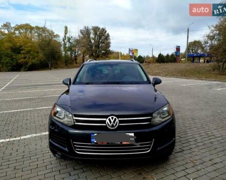 Серый Фольксваген Туарег, объемом двигателя 3 л и пробегом 250 тыс. км за 14500 $, фото 1 на Automoto.ua