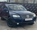Синий Фольксваген Туарег, объемом двигателя 2.46 л и пробегом 264 тыс. км за 9700 $, фото 1 на Automoto.ua