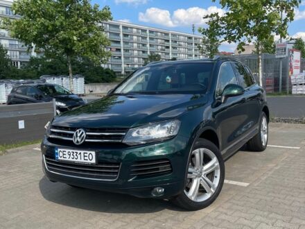 Зелений Фольксваген Туарег, об'ємом двигуна 3 л та пробігом 290 тис. км за 18865 $, фото 1 на Automoto.ua