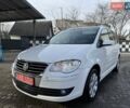 Белый Фольксваген Туран, объемом двигателя 1.4 л и пробегом 210 тыс. км за 6750 $, фото 1 на Automoto.ua