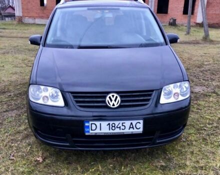 Черный Фольксваген Туран, объемом двигателя 2 л и пробегом 400 тыс. км за 4999 $, фото 2 на Automoto.ua