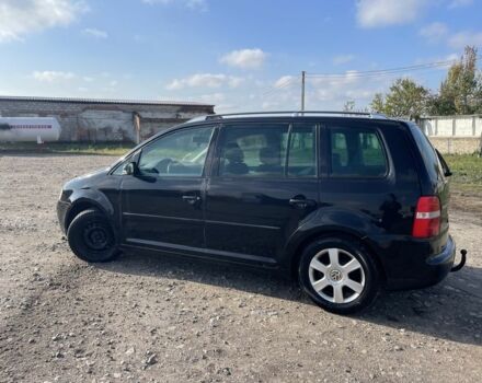 Черный Фольксваген Туран, объемом двигателя 2 л и пробегом 250 тыс. км за 2500 $, фото 1 на Automoto.ua