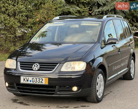 Черный Фольксваген Туран, объемом двигателя 1.6 л и пробегом 192 тыс. км за 4900 $, фото 1 на Automoto.ua