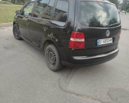 Чорний Фольксваген Туран, об'ємом двигуна 2 л та пробігом 350 тис. км за 5500 $, фото 3 на Automoto.ua