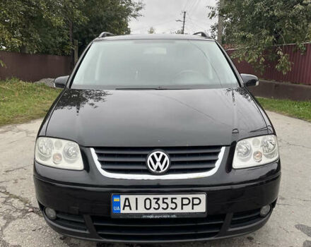 Черный Фольксваген Туран, объемом двигателя 1.6 л и пробегом 235 тыс. км за 6500 $, фото 2 на Automoto.ua