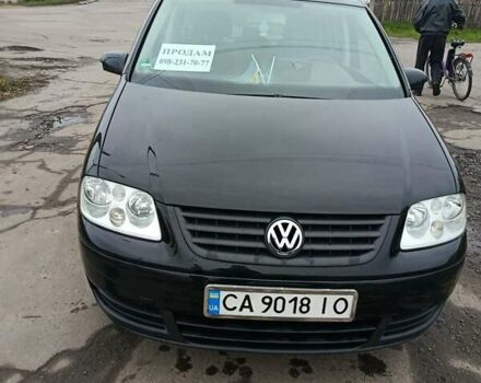 Черный Фольксваген Туран, объемом двигателя 1.6 л и пробегом 304 тыс. км за 4500 $, фото 2 на Automoto.ua