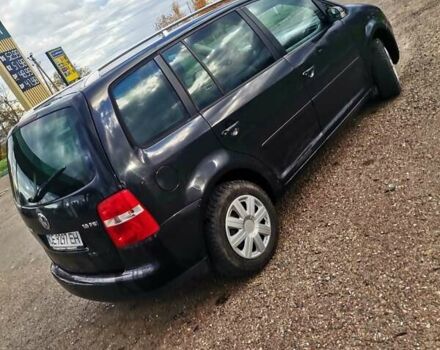 Черный Фольксваген Туран, объемом двигателя 1.6 л и пробегом 218 тыс. км за 5600 $, фото 8 на Automoto.ua