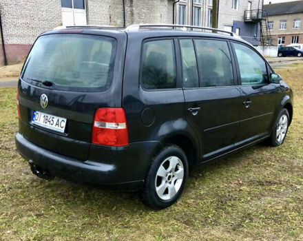 Черный Фольксваген Туран, объемом двигателя 1.97 л и пробегом 400 тыс. км за 4999 $, фото 4 на Automoto.ua