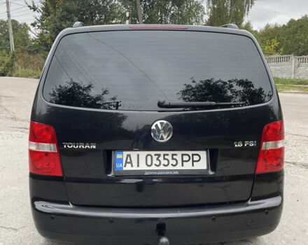 Черный Фольксваген Туран, объемом двигателя 1.6 л и пробегом 235 тыс. км за 6500 $, фото 1 на Automoto.ua