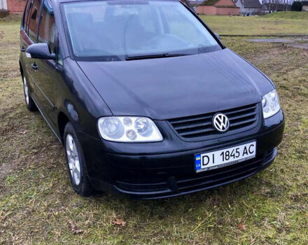Черный Фольксваген Туран, объемом двигателя 1.97 л и пробегом 400 тыс. км за 4999 $, фото 1 на Automoto.ua