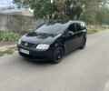 Черный Фольксваген Туран, объемом двигателя 2 л и пробегом 262 тыс. км за 4662 $, фото 1 на Automoto.ua