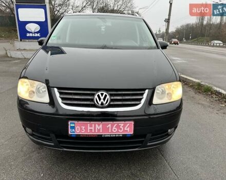 Черный Фольксваген Туран, объемом двигателя 1.6 л и пробегом 192 тыс. км за 5700 $, фото 1 на Automoto.ua