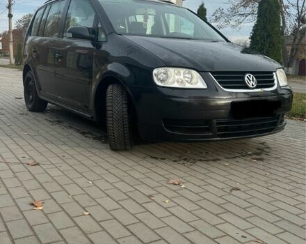 Чорний Фольксваген Туран, об'ємом двигуна 2 л та пробігом 300 тис. км за 2500 $, фото 4 на Automoto.ua