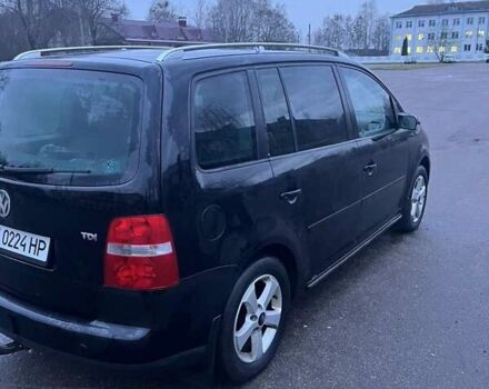 Черный Фольксваген Туран, объемом двигателя 1.97 л и пробегом 293 тыс. км за 5900 $, фото 6 на Automoto.ua