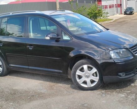 Черный Фольксваген Туран, объемом двигателя 2 л и пробегом 260 тыс. км за 6500 $, фото 2 на Automoto.ua