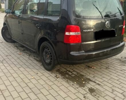 Чорний Фольксваген Туран, об'ємом двигуна 2 л та пробігом 300 тис. км за 2500 $, фото 2 на Automoto.ua