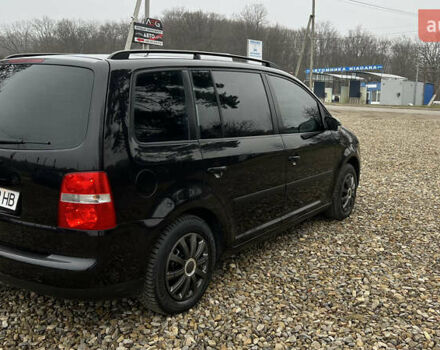 Черный Фольксваген Туран, объемом двигателя 1.6 л и пробегом 208 тыс. км за 5700 $, фото 35 на Automoto.ua