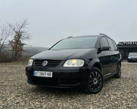 Черный Фольксваген Туран, объемом двигателя 1.6 л и пробегом 208 тыс. км за 5700 $, фото 2 на Automoto.ua