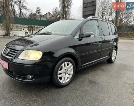 Черный Фольксваген Туран, объемом двигателя 1.6 л и пробегом 192 тыс. км за 5700 $, фото 2 на Automoto.ua