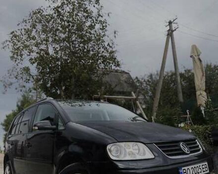 Черный Фольксваген Туран, объемом двигателя 1.98 л и пробегом 336 тыс. км за 5750 $, фото 1 на Automoto.ua