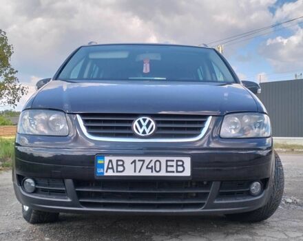 Черный Фольксваген Туран, объемом двигателя 2 л и пробегом 260 тыс. км за 6500 $, фото 1 на Automoto.ua