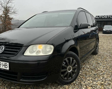 Черный Фольксваген Туран, объемом двигателя 1.6 л и пробегом 208 тыс. км за 5700 $, фото 1 на Automoto.ua