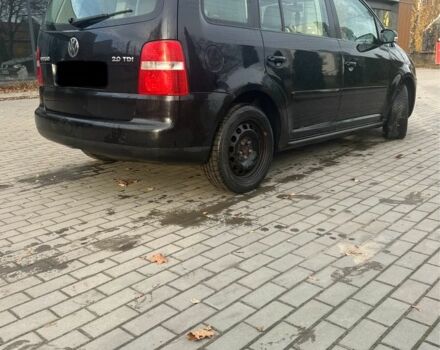 Чорний Фольксваген Туран, об'ємом двигуна 2 л та пробігом 300 тис. км за 2500 $, фото 1 на Automoto.ua
