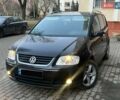 Чорний Фольксваген Туран, об'ємом двигуна 2 л та пробігом 280 тис. км за 4400 $, фото 1 на Automoto.ua