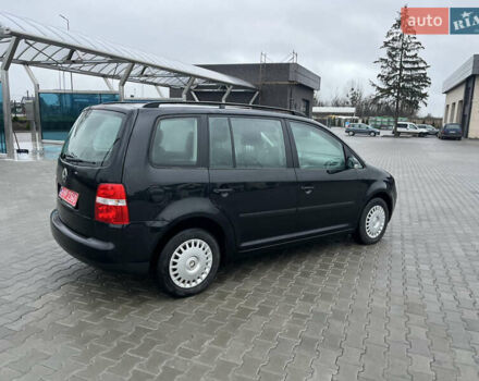 Черный Фольксваген Туран, объемом двигателя 1.6 л и пробегом 213 тыс. км за 5500 $, фото 3 на Automoto.ua