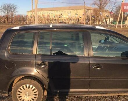 Черный Фольксваген Туран, объемом двигателя 1.97 л и пробегом 347 тыс. км за 5300 $, фото 1 на Automoto.ua