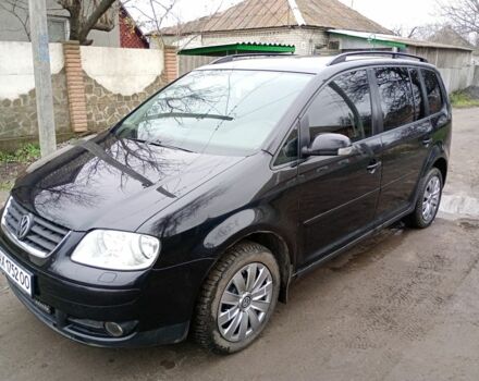 Черный Фольксваген Туран, объемом двигателя 1.6 л и пробегом 220 тыс. км за 6300 $, фото 2 на Automoto.ua