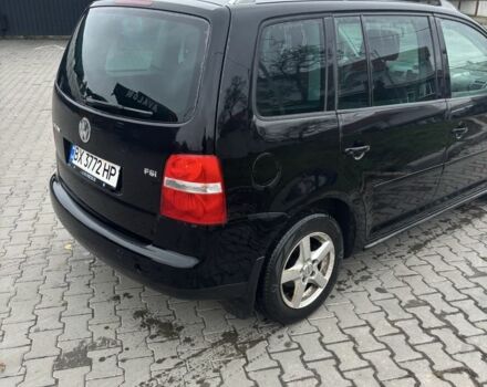 Черный Фольксваген Туран, объемом двигателя 1.6 л и пробегом 290 тыс. км за 4600 $, фото 2 на Automoto.ua