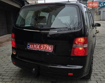 Черный Фольксваген Туран, объемом двигателя 1.6 л и пробегом 219 тыс. км за 5399 $, фото 8 на Automoto.ua