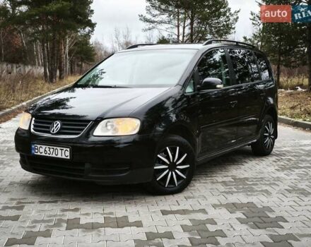 Черный Фольксваген Туран, объемом двигателя 2 л и пробегом 321 тыс. км за 5500 $, фото 1 на Automoto.ua