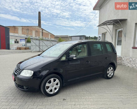 Черный Фольксваген Туран, объемом двигателя 1.98 л и пробегом 188 тыс. км за 4600 $, фото 5 на Automoto.ua