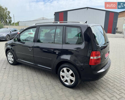 Черный Фольксваген Туран, объемом двигателя 1.98 л и пробегом 188 тыс. км за 4600 $, фото 10 на Automoto.ua