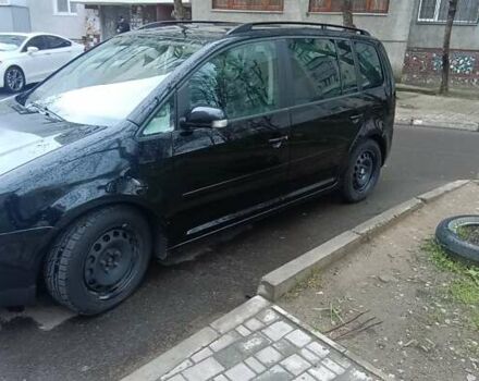 Черный Фольксваген Туран, объемом двигателя 1.97 л и пробегом 243 тыс. км за 6400 $, фото 6 на Automoto.ua