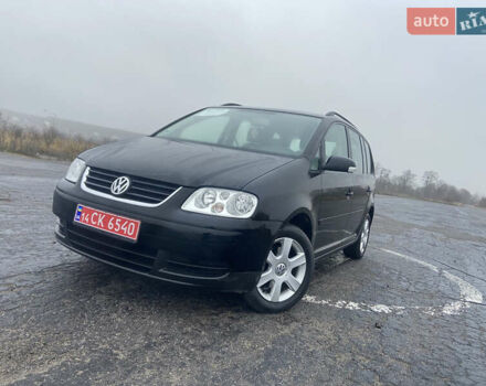 Черный Фольксваген Туран, объемом двигателя 1.6 л и пробегом 198 тыс. км за 6800 $, фото 1 на Automoto.ua