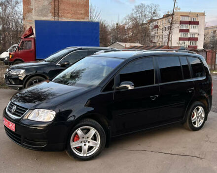 Черный Фольксваген Туран, объемом двигателя 1.6 л и пробегом 229 тыс. км за 6450 $, фото 1 на Automoto.ua