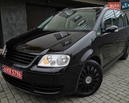 Черный Фольксваген Туран, объемом двигателя 1.6 л и пробегом 219 тыс. км за 5399 $, фото 1 на Automoto.ua