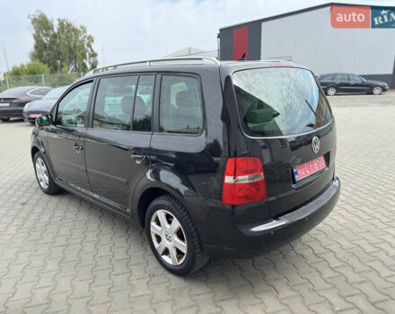 Черный Фольксваген Туран, объемом двигателя 1.98 л и пробегом 188 тыс. км за 4600 $, фото 11 на Automoto.ua