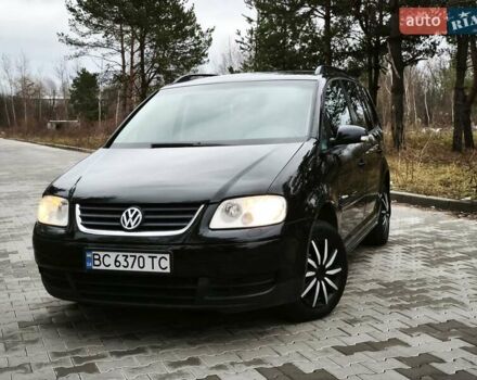 Черный Фольксваген Туран, объемом двигателя 2 л и пробегом 321 тыс. км за 5500 $, фото 2 на Automoto.ua