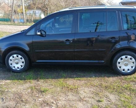 Черный Фольксваген Туран, объемом двигателя 2 л и пробегом 290 тыс. км за 6000 $, фото 1 на Automoto.ua