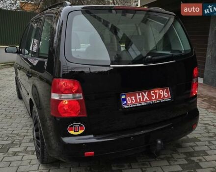 Черный Фольксваген Туран, объемом двигателя 1.6 л и пробегом 219 тыс. км за 5399 $, фото 6 на Automoto.ua