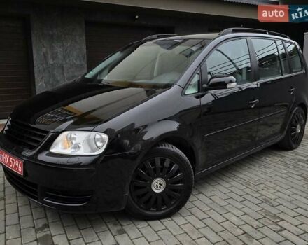 Черный Фольксваген Туран, объемом двигателя 1.6 л и пробегом 219 тыс. км за 5399 $, фото 2 на Automoto.ua