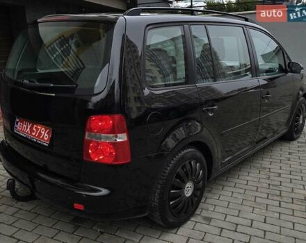 Черный Фольксваген Туран, объемом двигателя 1.6 л и пробегом 219 тыс. км за 5399 $, фото 9 на Automoto.ua