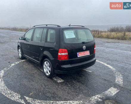 Черный Фольксваген Туран, объемом двигателя 1.6 л и пробегом 198 тыс. км за 6800 $, фото 11 на Automoto.ua